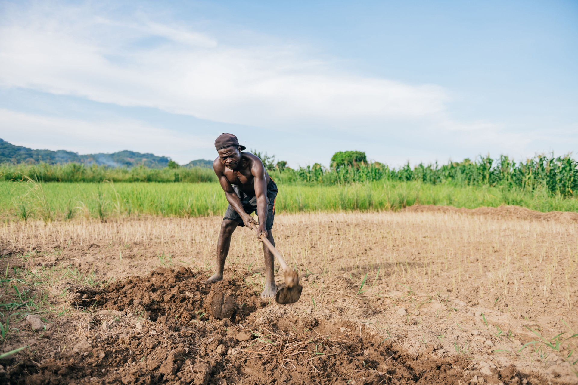 african farmer digging over the soil